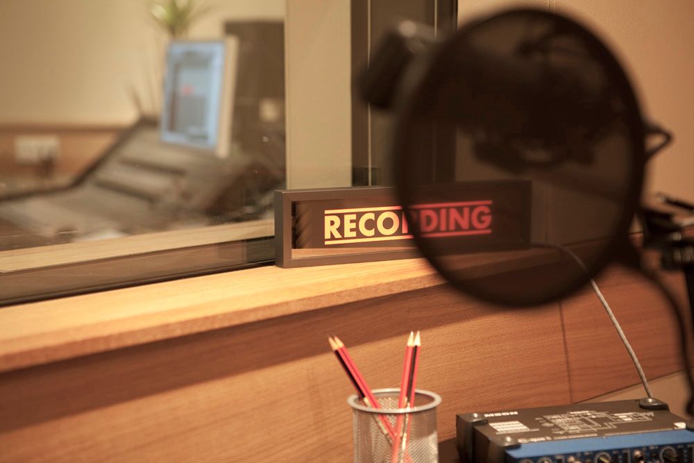 Pop shield and recording sign